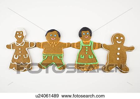 Four male and female gingerbread cookies holding hands View Large Photo Image Stock Photo - Four male and female gingerbread cookies holding hands. Fotosearch