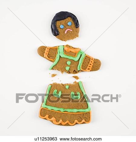 Frowning female gingerbread cookie broken in half. View Large Photo Image Stock Image - Frowning female gingerbread cookie broken in half.. Fotosearch