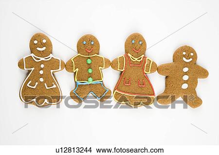 Picture - Gingerbread cookies holding hands.. Fotosearch