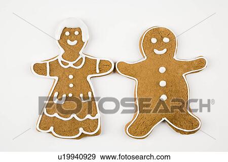 Stock Photo - Male and female gingerbread cookies holding hands.. Fotosearch