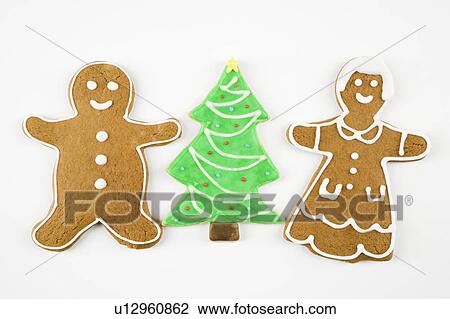 Sugar cookie Christmas tree between gingerbread male and female. View Large Photo Image Stock Image - Sugar cookie Christmas tree between gingerbread male and female.. Fotosearch