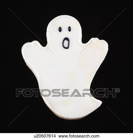 Picture - Sugar cookie in shape of a ghost with decorative icing.. Fotosearch