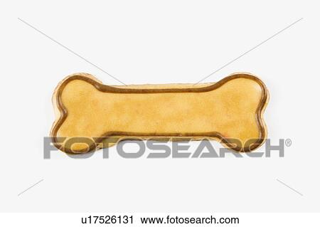 Stock Image - Sugar cookie in shape of dog bone with decorative icing.. Fotosearch