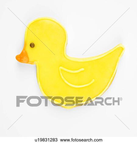 Stock Image - Sugar cookie in shape of duck with decorative icing.. Fotosearch