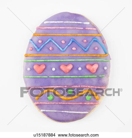 Picture - Sugar cookie in shape of Easter egg with decorative icing.. Fotosearch