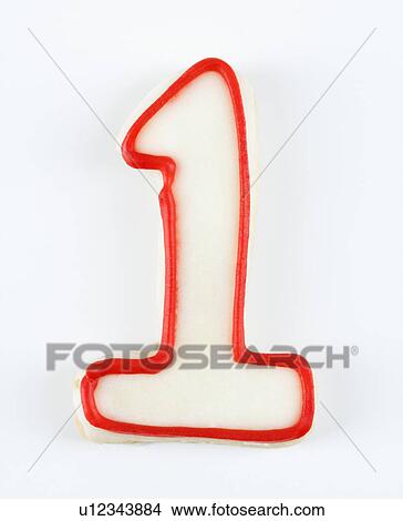 Sugar cookie in the shape of a number one outlined in red icing. View Large Photo Image Picture - Sugar cookie in the shape of a number one outlined in red icing.. Fotosearch