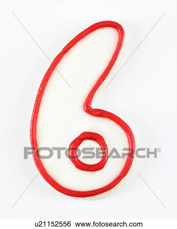 Stock Photograph - Sugar cookie in the shape of a number six outlined in red icing.. Fotosearch