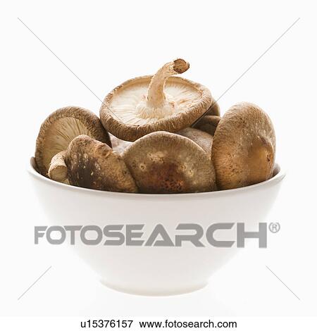 Stock Photo - Bowlful of shiitake mushrooms on white background.. Fotosearch