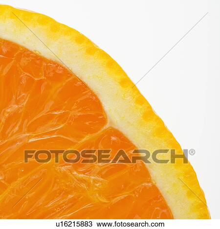 Stock Image - Close up of halved orange against white background.. Fotosearch