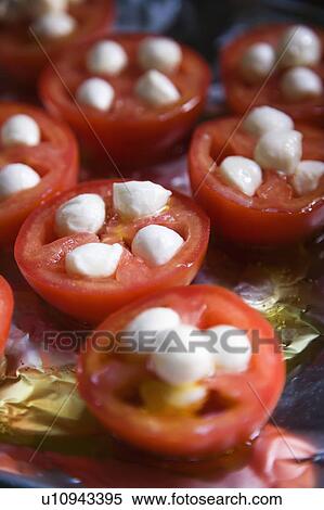 Group of tomatoes and mozzarella cheese on aluminum foil. View Large Photo Image Stock Photography - Group of tomatoes and mozzarella cheese on aluminum foil.. Fotosearch