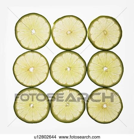 Lime slices arranged in square design on white background. View Large Photo Image Picture - Lime slices arranged in square design on white background.. Fotosearch