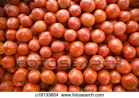 Picture - Pile of red tomatoes at produce market.. Fotosearch
