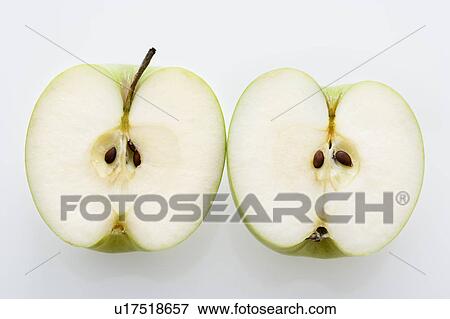 Stock Photo - Still life of sliced green apples on white background.. Fotosearch
