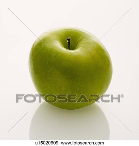 Stock Photo - Still life of whole green apple on white background.. Fotosearch
