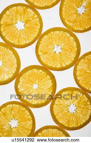 Orange slices arranged in design on white background. View Large Photo Image Stock Image - Orange slices arranged in design on white background.. Fotosearch