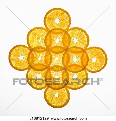 Stock Photo - Orange slices arranged in design on white background.. Fotosearch
