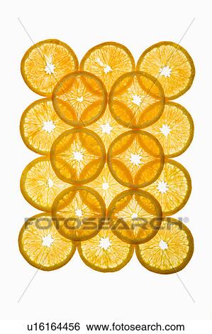Stock Photograph - Orange slices arranged in design on white background.. Fotosearch