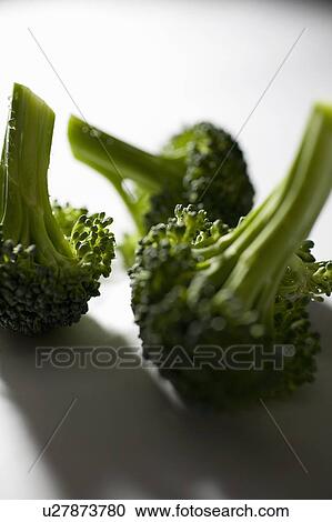 Stock Image - 3 florets of broccoli. Fotosearch