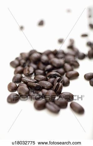 Stock Photography - Coffee beans on white surface. Fotosearch