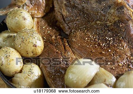 Roasted potatoes with roast pork sprinkled with spices View Large Photo Image Stock Photo - Roasted potatoes with roast pork sprinkled with spices. Fotosearch