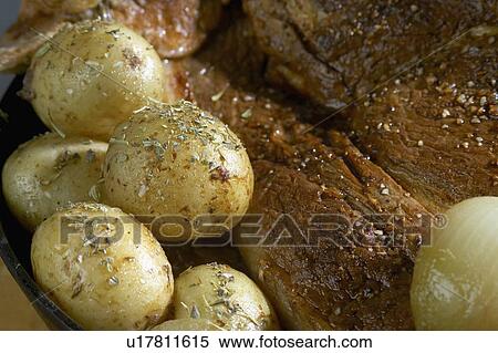 Roasted potatoes with roast pork sprinkled with spices View Large Photo Image Stock Photography - Roasted potatoes with roast pork sprinkled with spices. Fotosearch