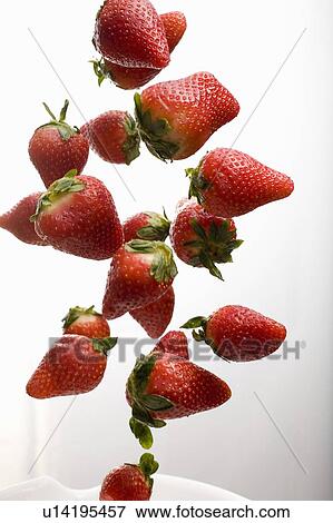 Strawberries falling View Large Photo Image Stock Photo - Strawberries falling. Fotosearch