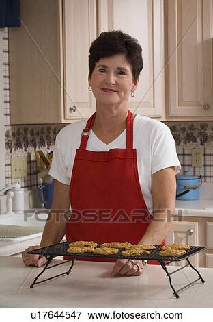 Grandma baking cookies View Large Photo Image Stock Photo - Grandma baking cookies. Fotosearch