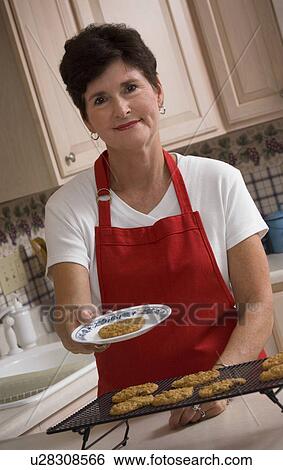 Stock Photograph - Grandma baking cookies. Fotosearch