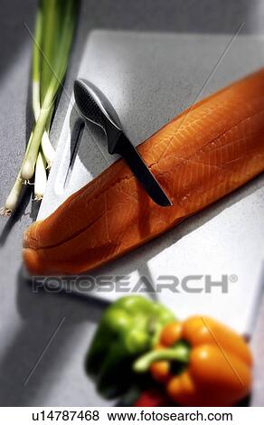 Stock Photo - Salmon being prepared. Fotosearch