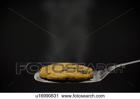 Warm cookie on spatula View Large Photo Image Stock Image - Warm cookie on spatula. Fotosearch