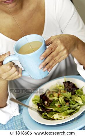 Woman eating a salad View Large Photo Image Stock Photography - Woman eating a salad. Fotosearch