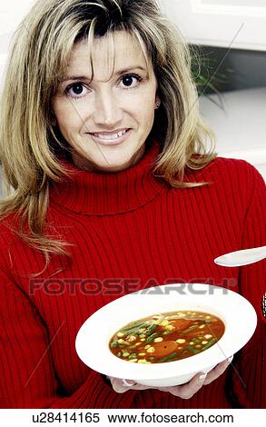 Woman eating soup View Large Photo Image Stock Photography - Woman eating soup. Fotosearch
