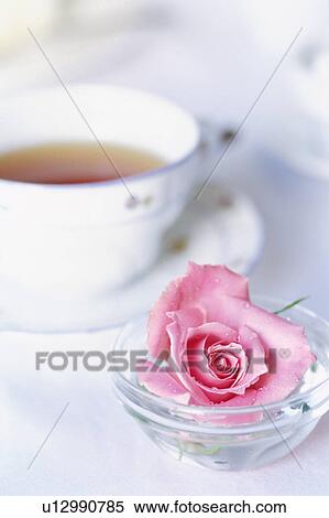 Stock Photography - A cup of tea and rose. Fotosearch