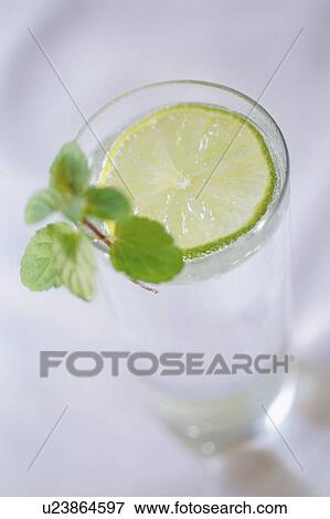 Stock Photo - A glass of lemon water. Fotosearch
