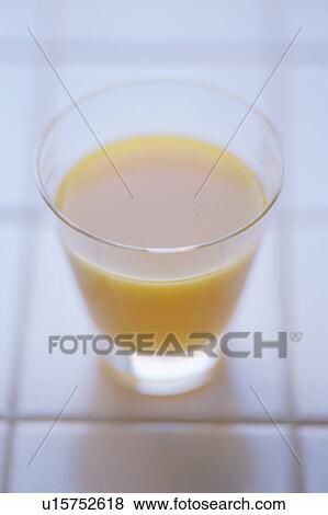 Stock Photo - A glass of orange juice. Fotosearch