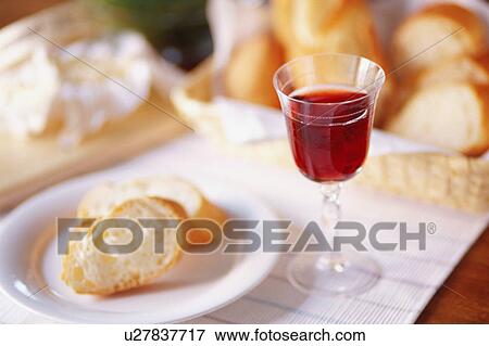 Stock Photo - Baguette and glass of wine. Fotosearch