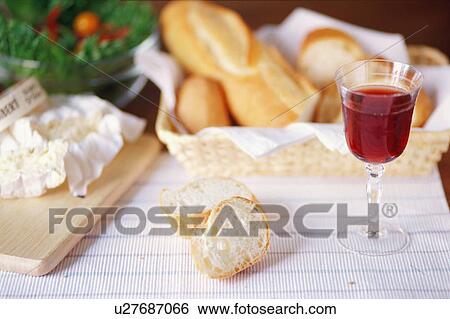 Bread, cheese and a glass of wine View Large Photo Image Stock Photograph - Bread, cheese and a glass of wine. Fotosearch