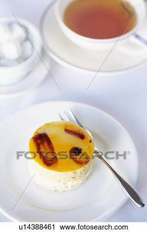 Cake and a cup of tea View Large Photo Image Stock Image - Cake and a cup of tea. Fotosearch