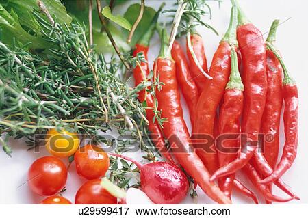 Herbs and red chili peppers View Large Photo Image Stock Photo - Herbs and red chili peppers. Fotosearch
