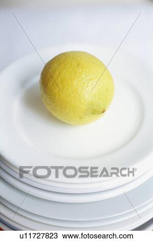 Stock Image - Lemon in plates. Fotosearch