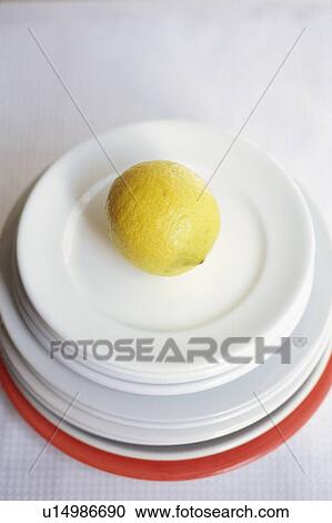 Stock Image - Lemon in plates. Fotosearch
