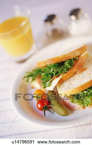 Sandwiches and glass of orange juice View Large Photo Image Stock Image - Sandwiches and glass of orange juice. Fotosearch