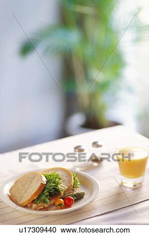 Sandwiches and glass of orange juice View Large Photo Image Stock Image - Sandwiches and glass of orange juice. Fotosearch