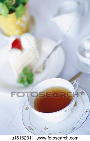 Strawberry cake and a cup of tea View Large Photo Image Stock Image - Strawberry cake and a cup of tea. Fotosearch