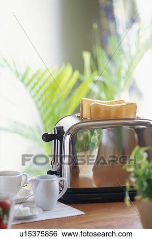 Stock Photograph - Toast and toaster. Fotosearch