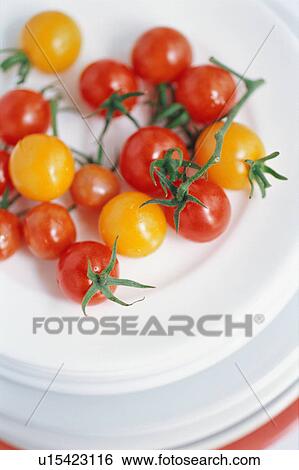 Stock Photograph - Tomatoes in plates. Fotosearch