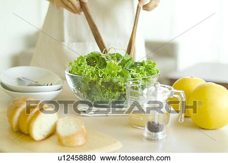 A woman preparing salad View Large Photo Image Stock Image - A woman preparing salad. Fotosearch