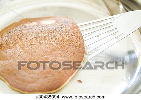 Cooking pancake View Large Photo Image Picture - Cooking pancake. Fotosearch