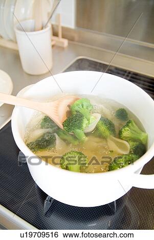 Stock Photograph - Cooking pasta with broccoli. Fotosearch