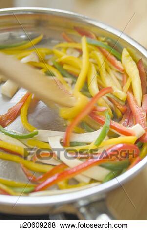 Cooking vegetables, blurred motion View Large Photo Image Stock Photo - Cooking vegetables, blurred motion. Fotosearch